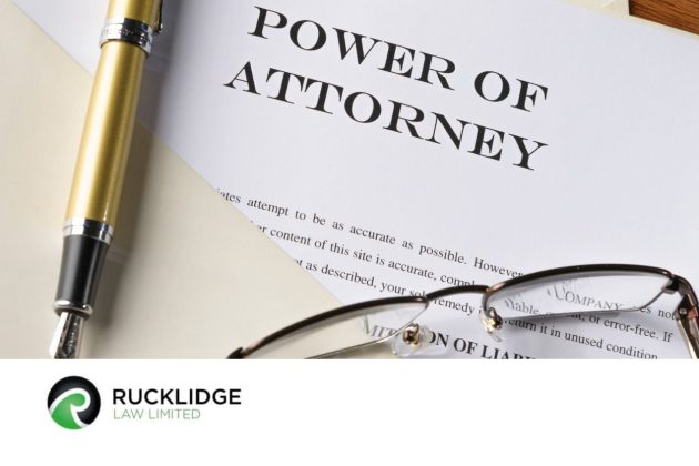 power of attorney document with pen and spectacles