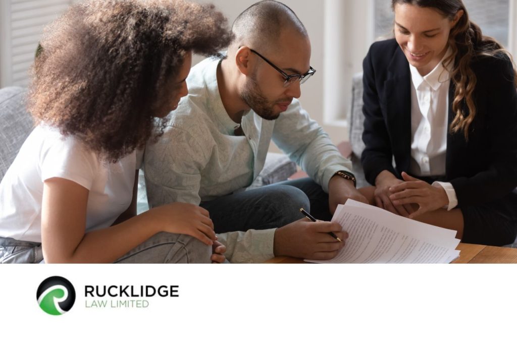 3 people looking at a document