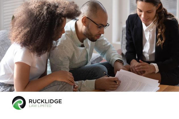 3 people looking at a document