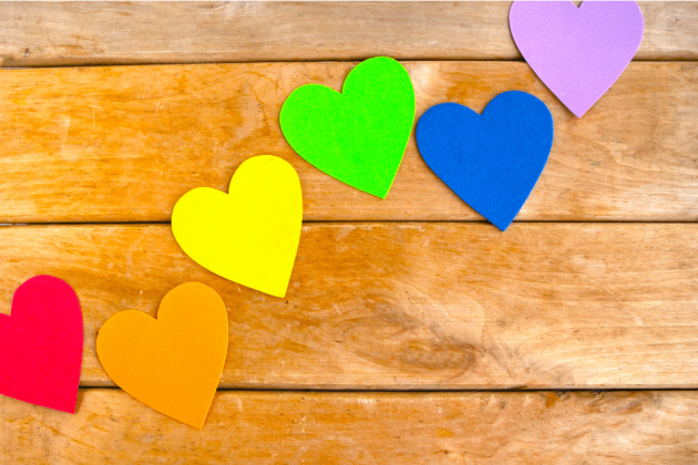 coloured hearts on wooden background